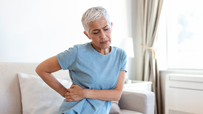 Old Woman With Lower Back Pain
